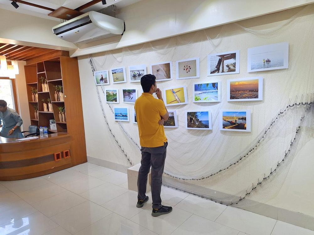 Visitor viewing photography submissions at an Earth 360 exhibition