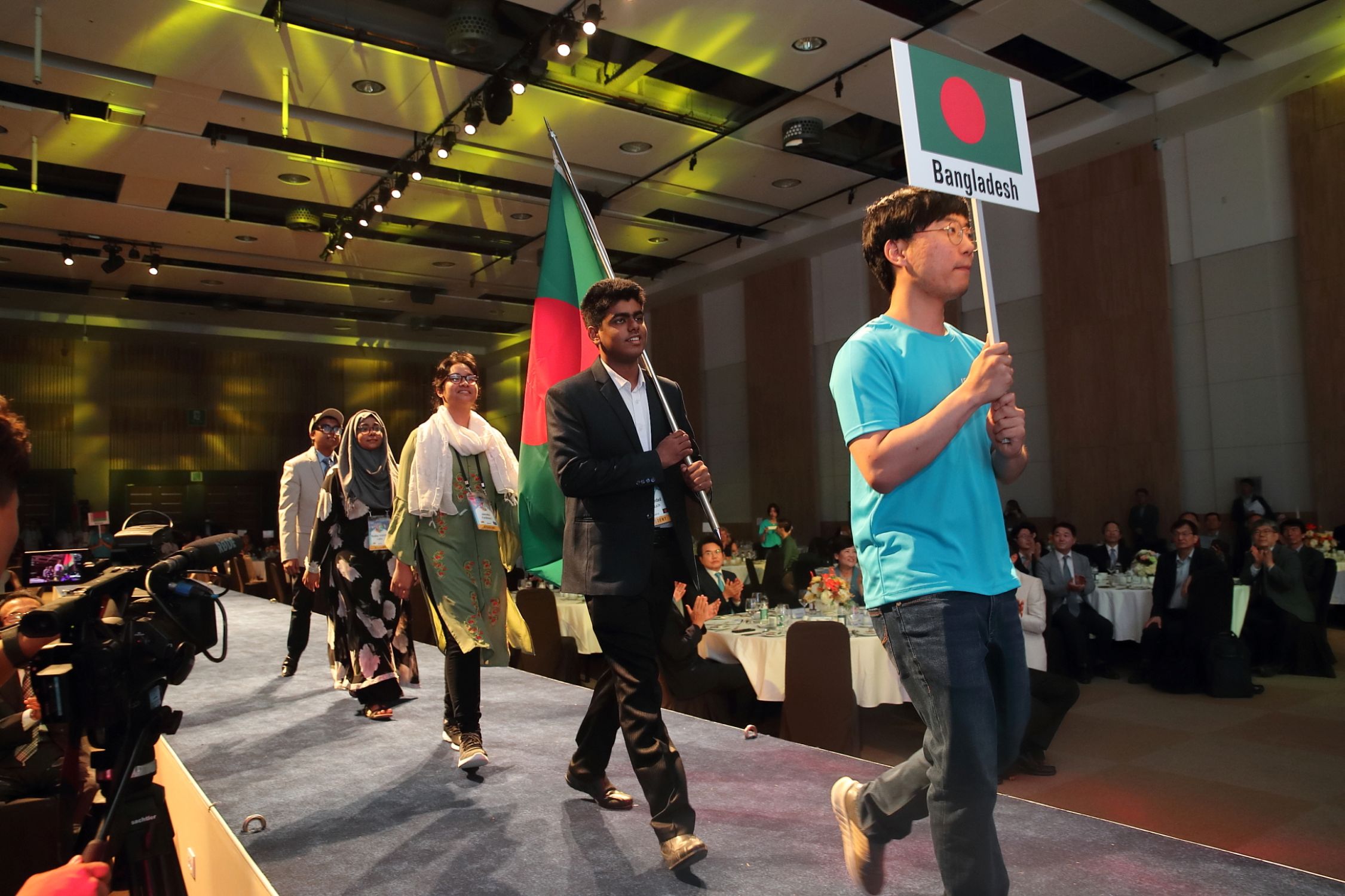 National Earth Olympiad award ceremony with students on stage